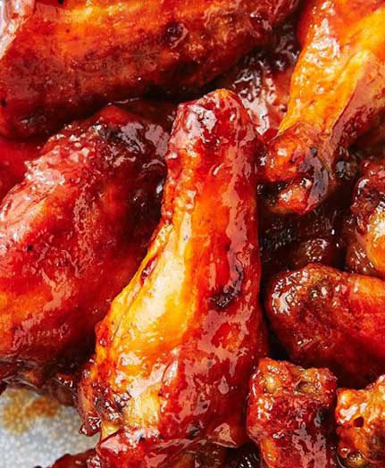 a close up of buffalo style chicken wings