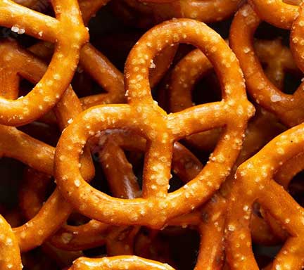 Lots of pretzels with flakes of slat on them